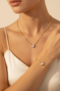 Model wearing Gold Cuban Chain Heart CZ Necklace and Bracelet Set
